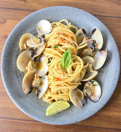 a plate of pasta with oysters and clams at Makarma Resort Lombok in Senggigi 