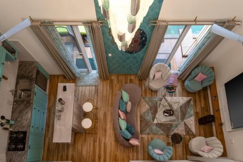 an overhead view of a living room with furniture and windows at Alaya Stays Cavalo Marinho - 3 BHK Boho Retreat with Private Pool & Terrace in Camorlim