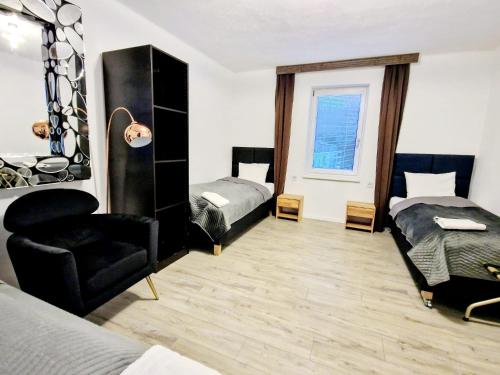 Postel nebo postele na pokoji v ubytování Tiny Apartments 07 am Viehofner See