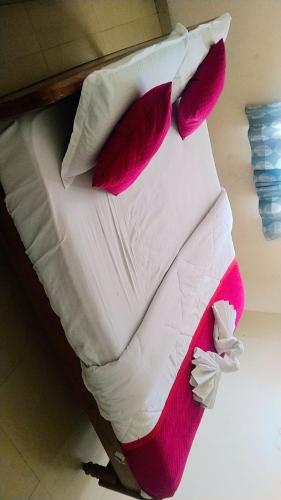 Cama o camas de una habitación en GK Saravana Bhavan