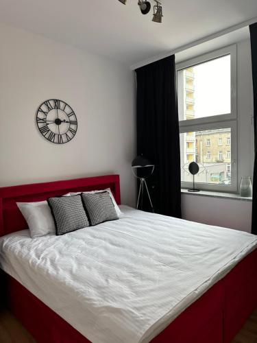 Ένα ή περισσότερα κρεβάτια σε δωμάτιο στο Apartamenty Center