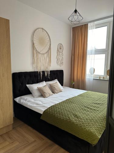 Ένα ή περισσότερα κρεβάτια σε δωμάτιο στο Apartamenty Center