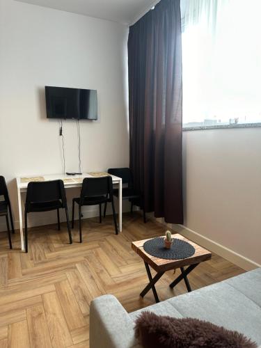 Μια τηλεόραση ή/και κέντρο ψυχαγωγίας στο Apartamenty Center