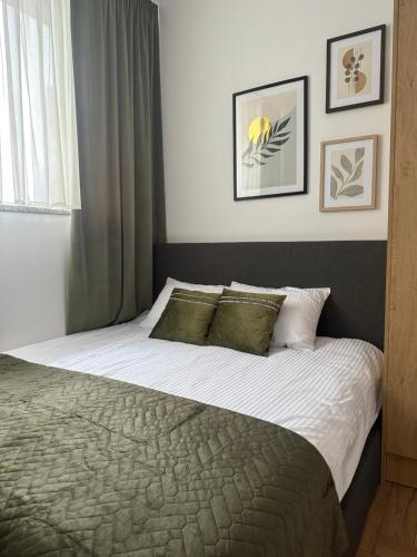 Ένα ή περισσότερα κρεβάτια σε δωμάτιο στο Apartamenty Center