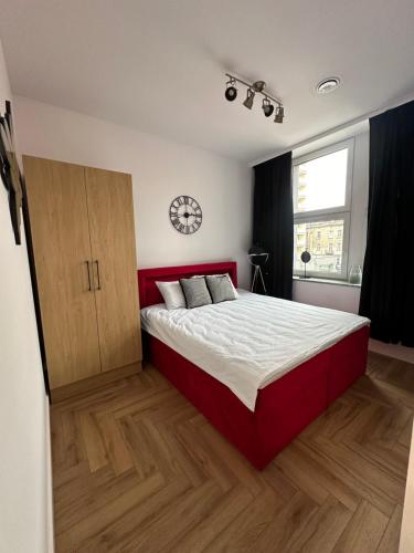 Ένα ή περισσότερα κρεβάτια σε δωμάτιο στο Apartamenty Center