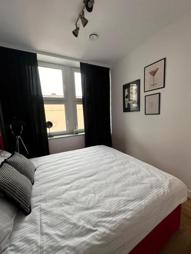 Ένα ή περισσότερα κρεβάτια σε δωμάτιο στο Apartamenty Center