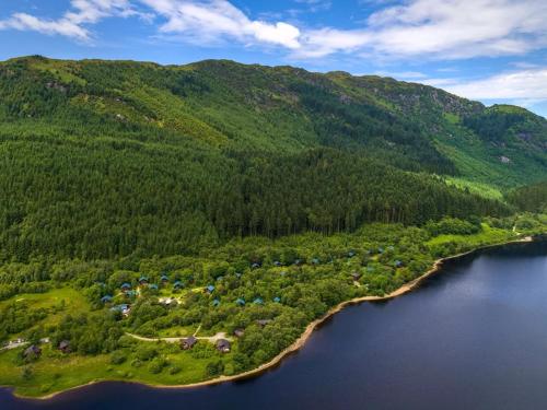 an island in the middle of a body of water at Strathyre, Ben Ledi Cabins - Forest Holidays in Callander
