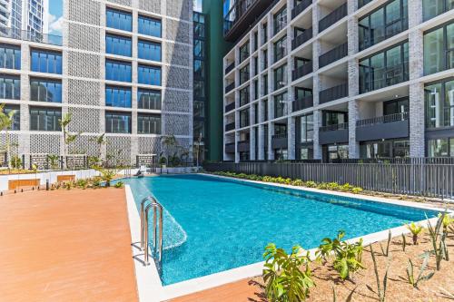 an image of a swimming pool in front of a building at New 2BR Apartment in Olympic Park Near Stadium in Sydney