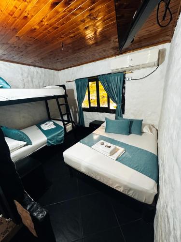 Postel nebo postele na pokoji v ubytování Hotel Mawill