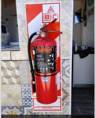 a sign for a fire hydrant on a wall at LuMar2 in Comodoro Rivadavia