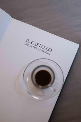 a cup of coffee sitting on a piece of paper at Concilium in Trento