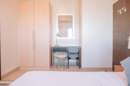 Ένα ή περισσότερα κρεβάτια σε δωμάτιο στο Elegant Living in the City