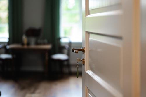 a white door with a door knob in a room at Gut Zahren in Gallin