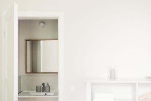 a bathroom with a mirror and a sink at Gut Zahren in Gallin