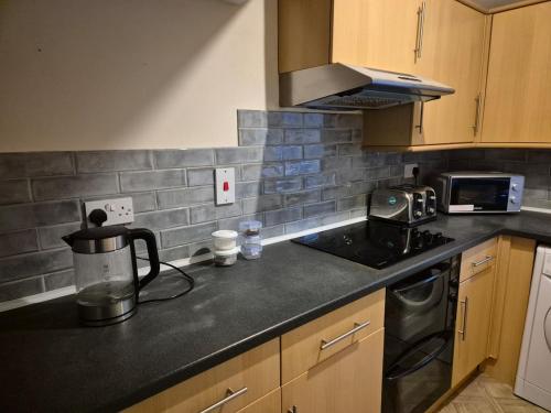 Η κουζίνα ή μικρή κουζίνα στο Harrogate central apartment