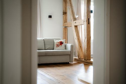 a living room with a couch and a window at Gut Zahren in Gallin