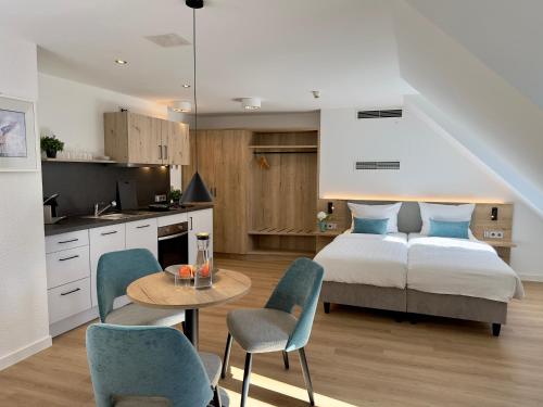 Kuchyň nebo kuchyňský kout v ubytování Living & Serviced Apartments by Blauer Wolf