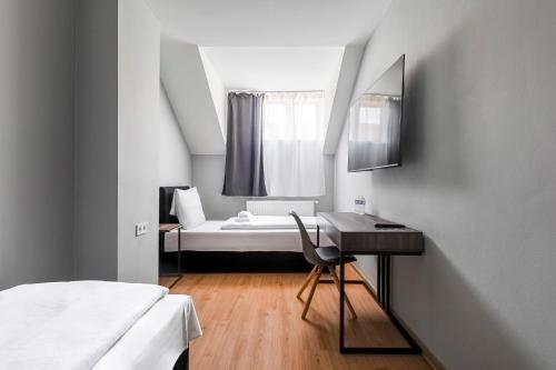 Ένα ή περισσότερα κρεβάτια σε δωμάτιο στο Koruna Hotel
