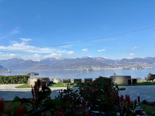 a view of the water with mountains in the background at Panorama Loft Apartments in Stresa