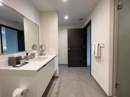 a bathroom with a sink and a mirror at A Fantastic apart with balcony and partial view of the beach 4 Px in Hollywood