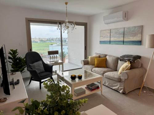 a living room with a couch and a chair at Brandnew Rooftop Flat near Larnaca Mall in Larnaca