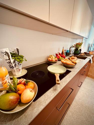 a kitchen with fruits and vegetables on a counter at New Studio with Sunny Terrace & Air Condition in Zürich
