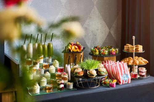 a table with many different types of food on at ibis Styles Szczecin Stare Miasto in Szczecin
