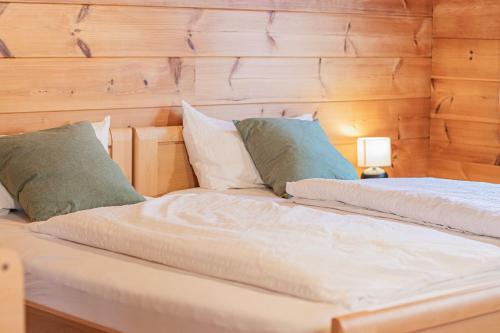 two beds sitting next to each other in a bedroom at Weingut und Ferienhof Josef Huber in Oberkirch