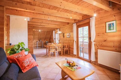 a living room with a couch and a table at Weingut und Ferienhof Josef Huber in Oberkirch