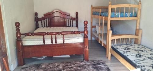 En eller flere senge i et værelse på Chácara Bons Companheiros