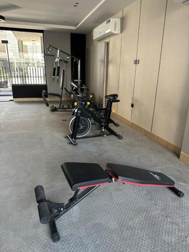 a gym with two exercise bikes in a room at Three bedrooms compound - شقة انيقة ثلاث غرف كمباوند in Dammam