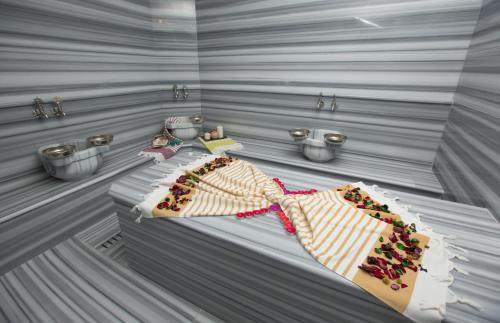 a room with a cake with cherries on it at Görükle Güler Park Hotel in Gorukle