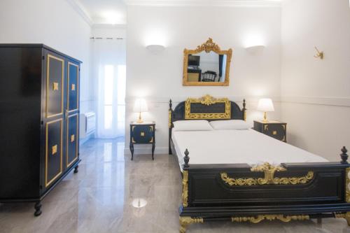 Postel nebo postele na pokoji v ubytování Casali Mediterranei Melissano by Palazzo Montagna