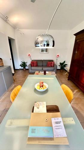 a living room with a table with a bowl of food on it at La Fornace in Alessandria