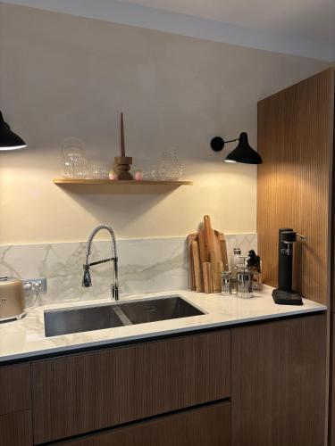 a kitchen with a sink and a counter at Villa LagoBlu in Costermano