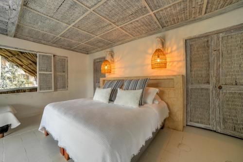 Letto o letti in una camera di Isla Matamba