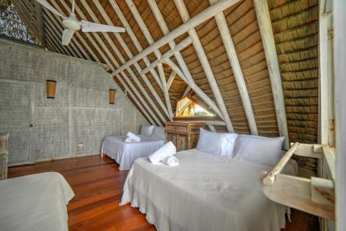 Letto o letti in una camera di Isla Matamba