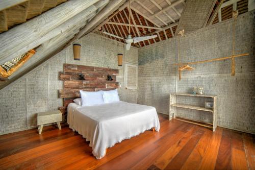 Letto o letti in una camera di Isla Matamba