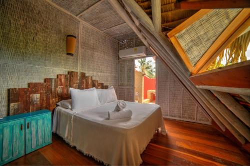 Letto o letti in una camera di Isla Matamba