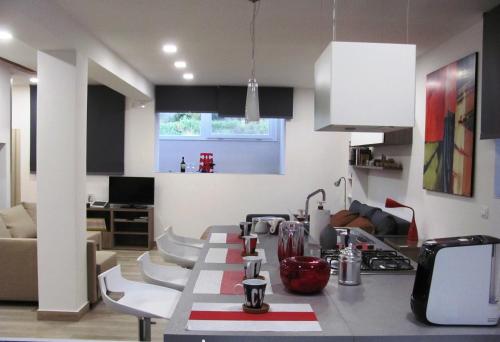 a kitchen with a counter top in a room at Folco Studio Apartment in Piazza Armerina