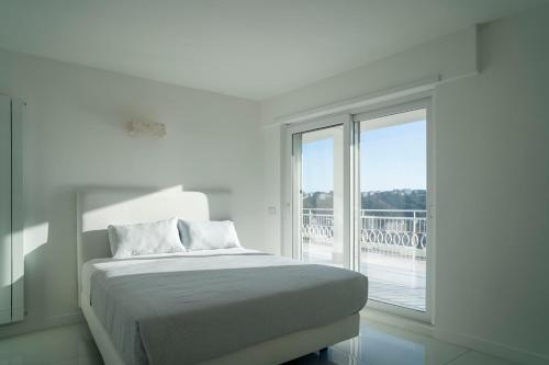 Ένα ή περισσότερα κρεβάτια σε δωμάτιο στο Caravaggio Luxury Apartment