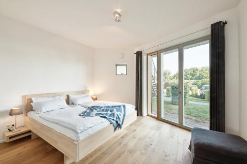 En eller flere senge i et værelse på Seglerwohnung 9