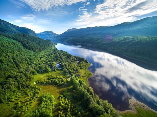 an aerial view of a river in the mountains at Strathyre, Ben Ledi Cabins - Forest Holidays in Callander