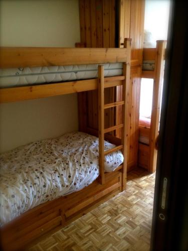 Ένα ή περισσότερα κρεβάτια σε δωμάτιο στο Monte Rosa Ski Apartment