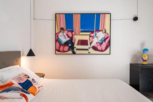 Postel nebo postele na pokoji v ubytování Dimora Del Vescovo Art Boutique Hotel