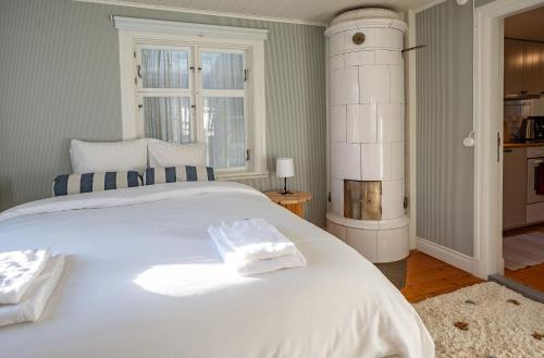 Una cama o camas en una habitación de Mundekulla