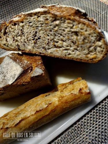 two slices of bread on a white plate at Chambres entre Romorantin-Chambord-Zoo de Beauval - Orée du Bois en Sologne in Lassay-sur-Croisne