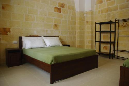 Ένα ή περισσότερα κρεβάτια σε δωμάτιο στο Casa Ninì