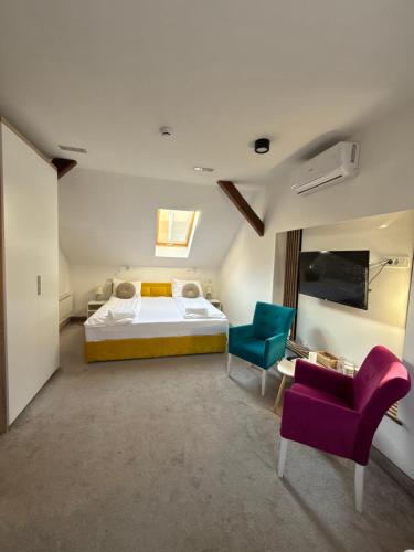 Postel nebo postele na pokoji v ubytování Deluxe Nortel Hotel