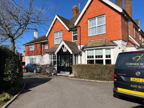 a house with a car parked in front of it at Corner House Hotel Gatwick with bookable Holiday parking in Horley